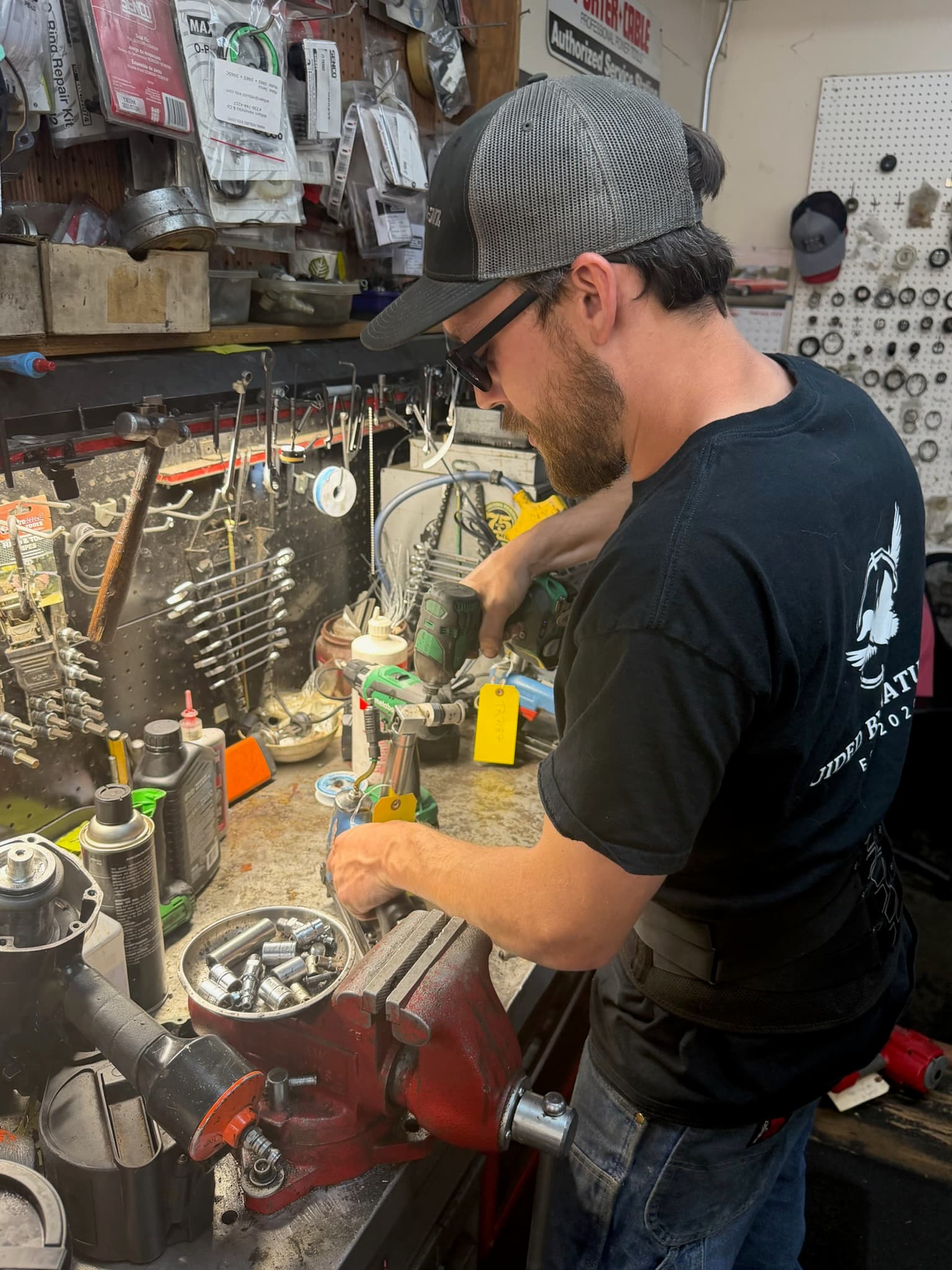 ANCO service technician repairing a tool